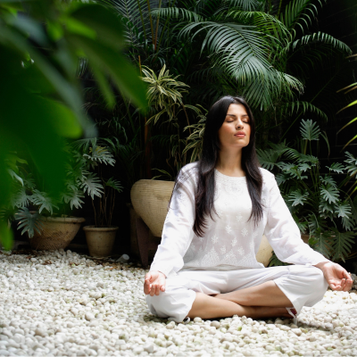 Woman doing yoga to practice self-care